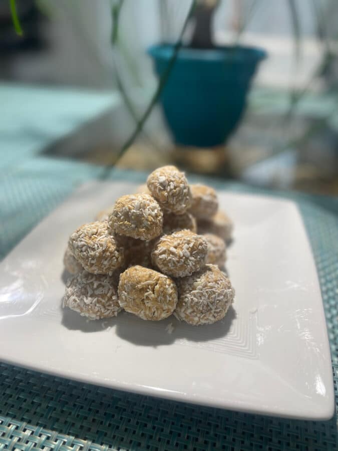 Picture of multiple AILI PB Protein Balls on a white plate.